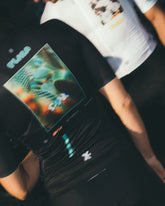 Man and Woman with backs to camera showing new Flora Jerseys